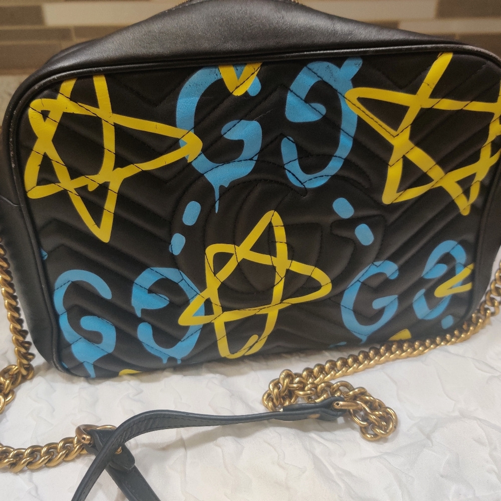 Stylish Black Designer Bag with Yellow and Blue Accents